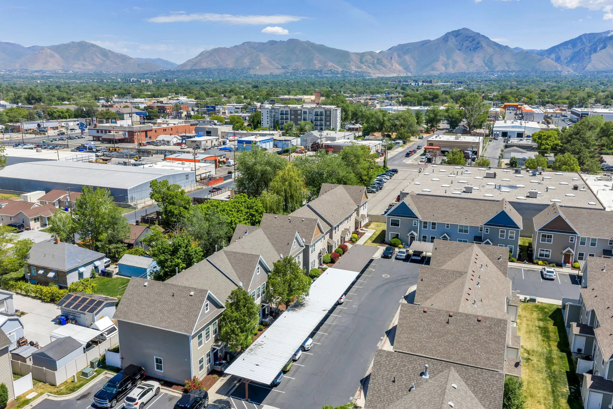 Townhome community featuring multi-story residences with gabled roofs