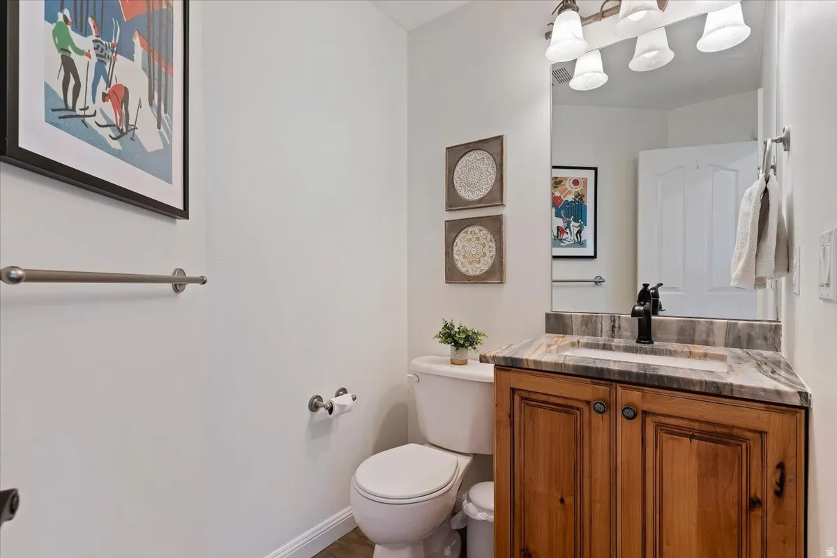 Bathroom featuring vanity and toilet