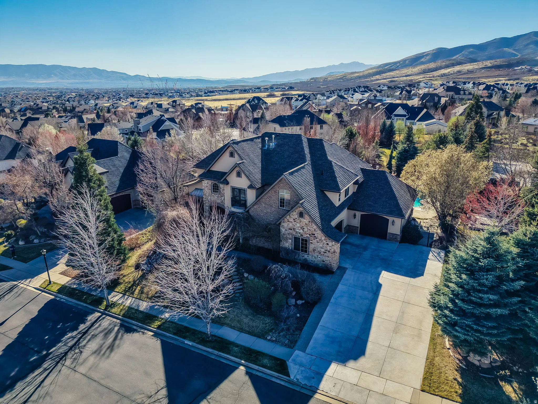 Aerial view of residential area with a mountainous background