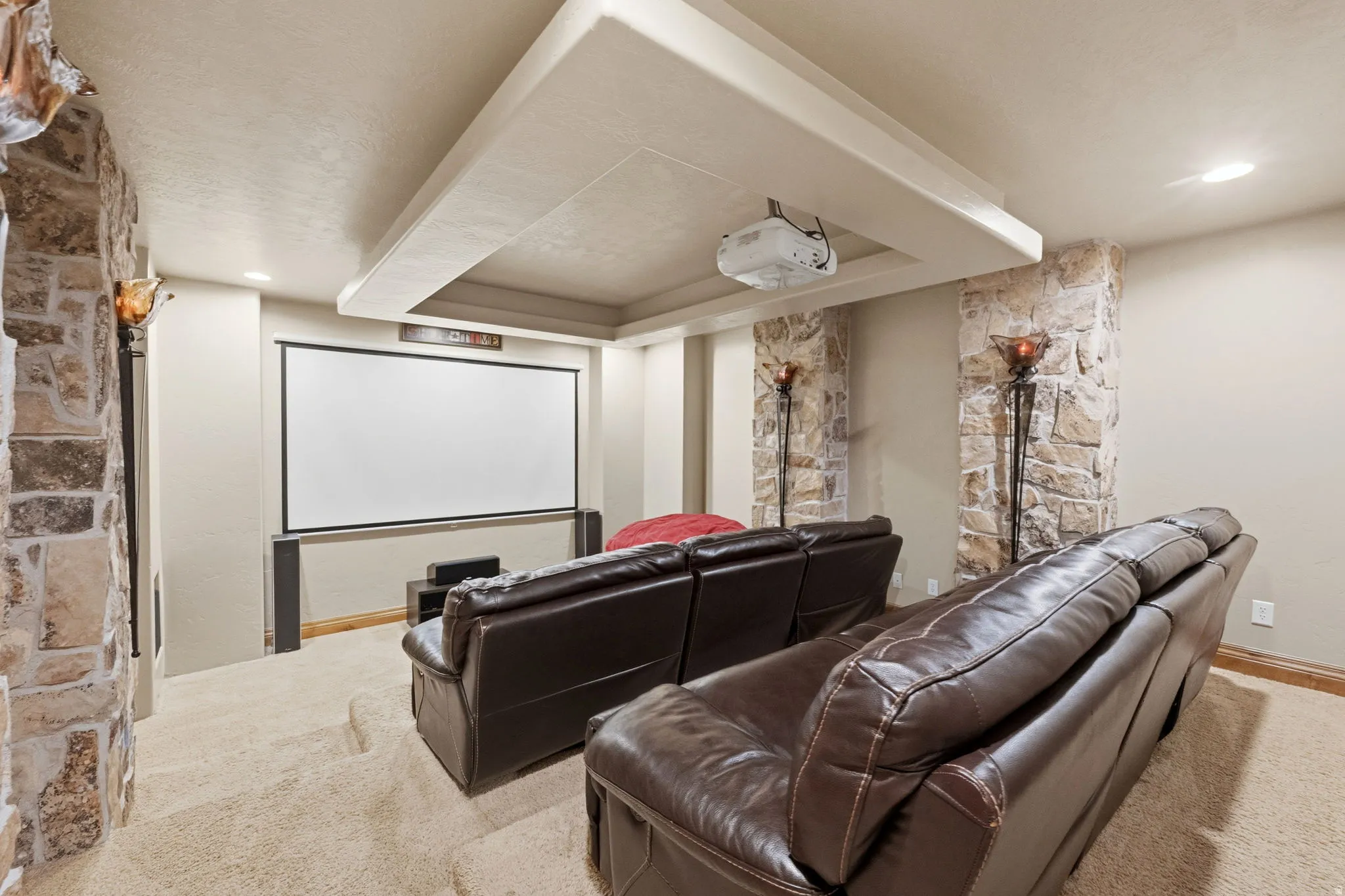 Cinema featuring light carpet and recessed lighting