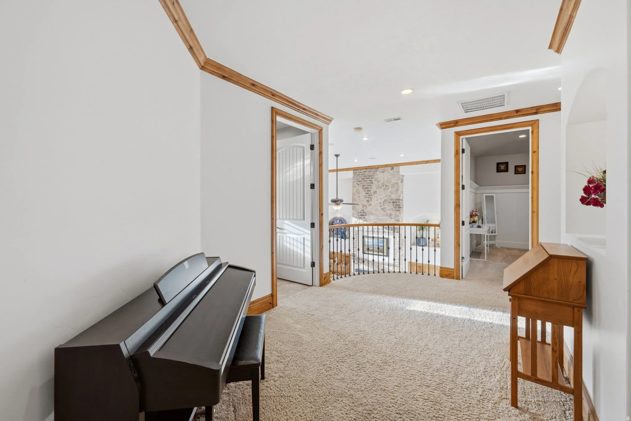 Hall featuring recessed lighting, light carpet, and ornamental molding