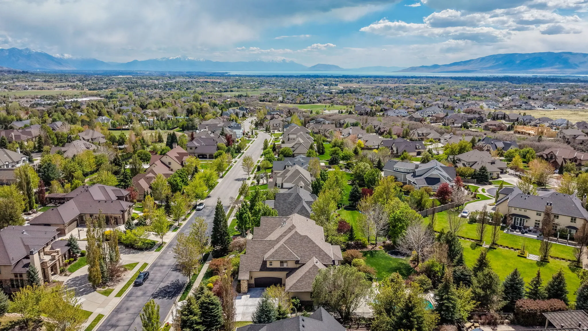 Aerial perspective of suburban area featuring a mountain backdrop