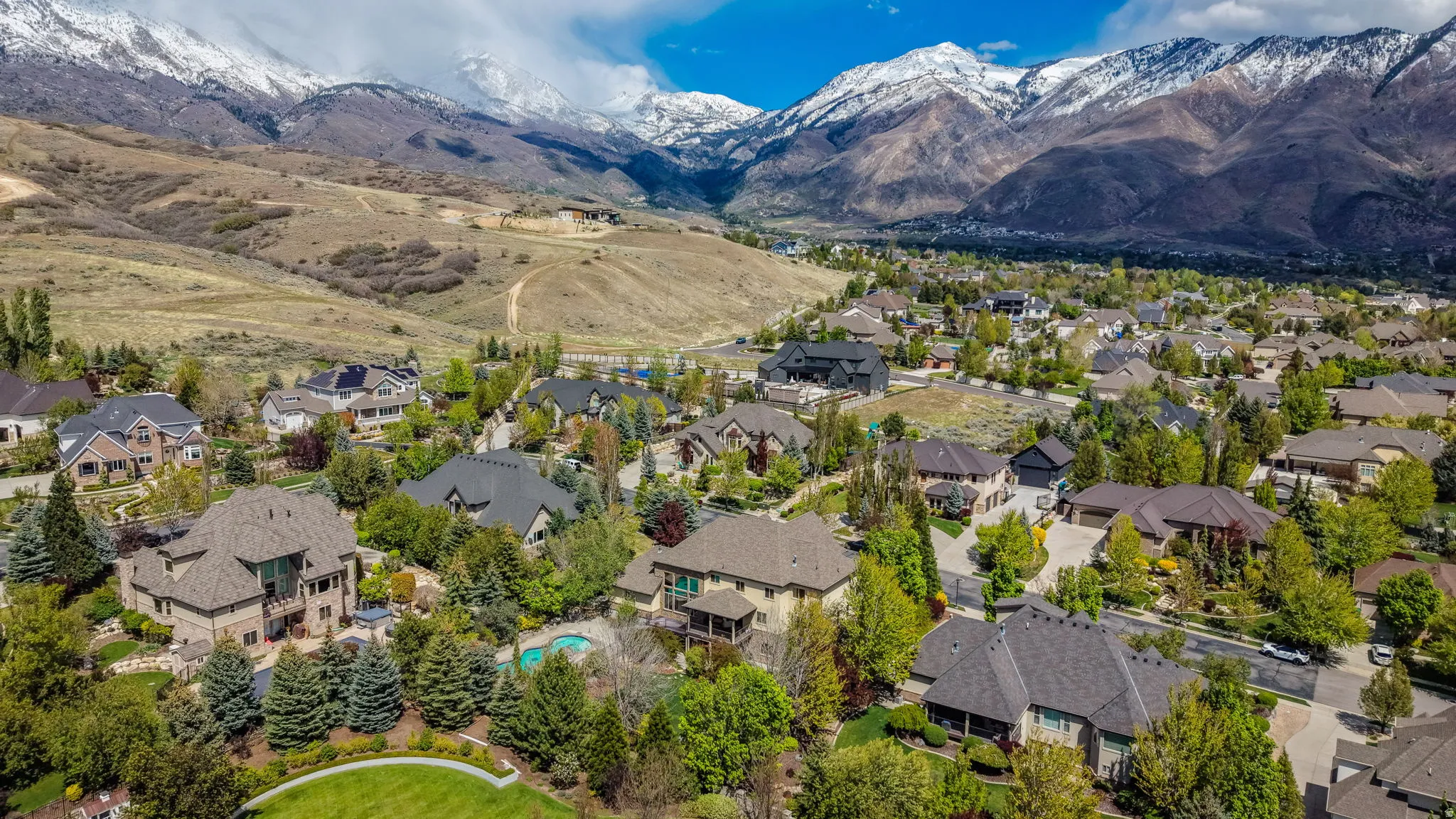 Aerial view of residential area with a mountainous background