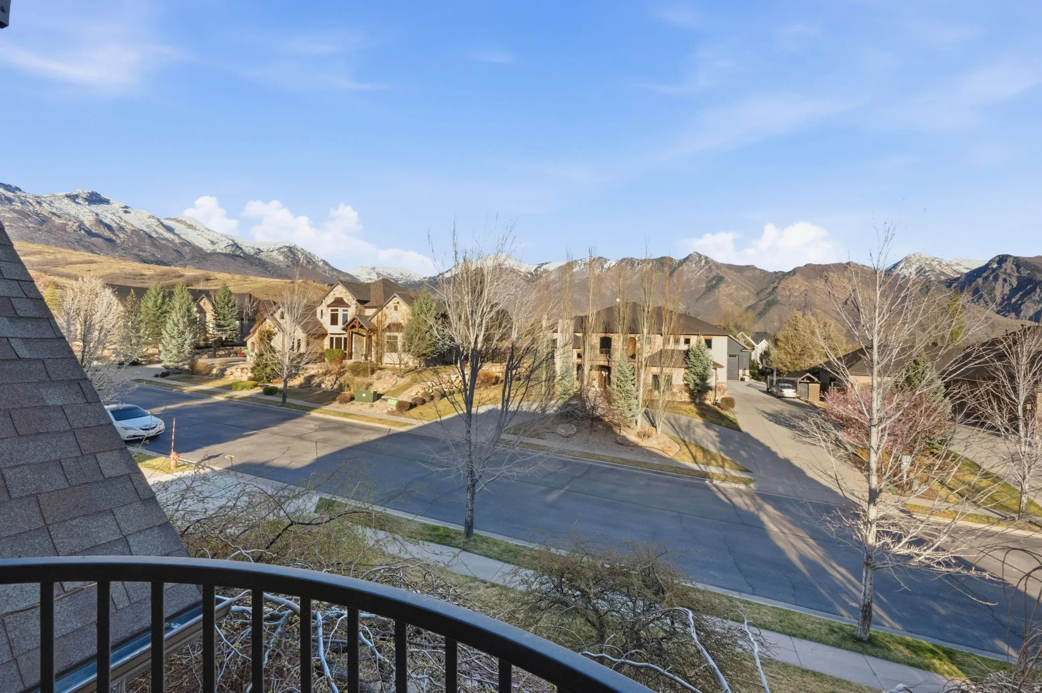 View of mountain backdrop featuring nearby suburban area