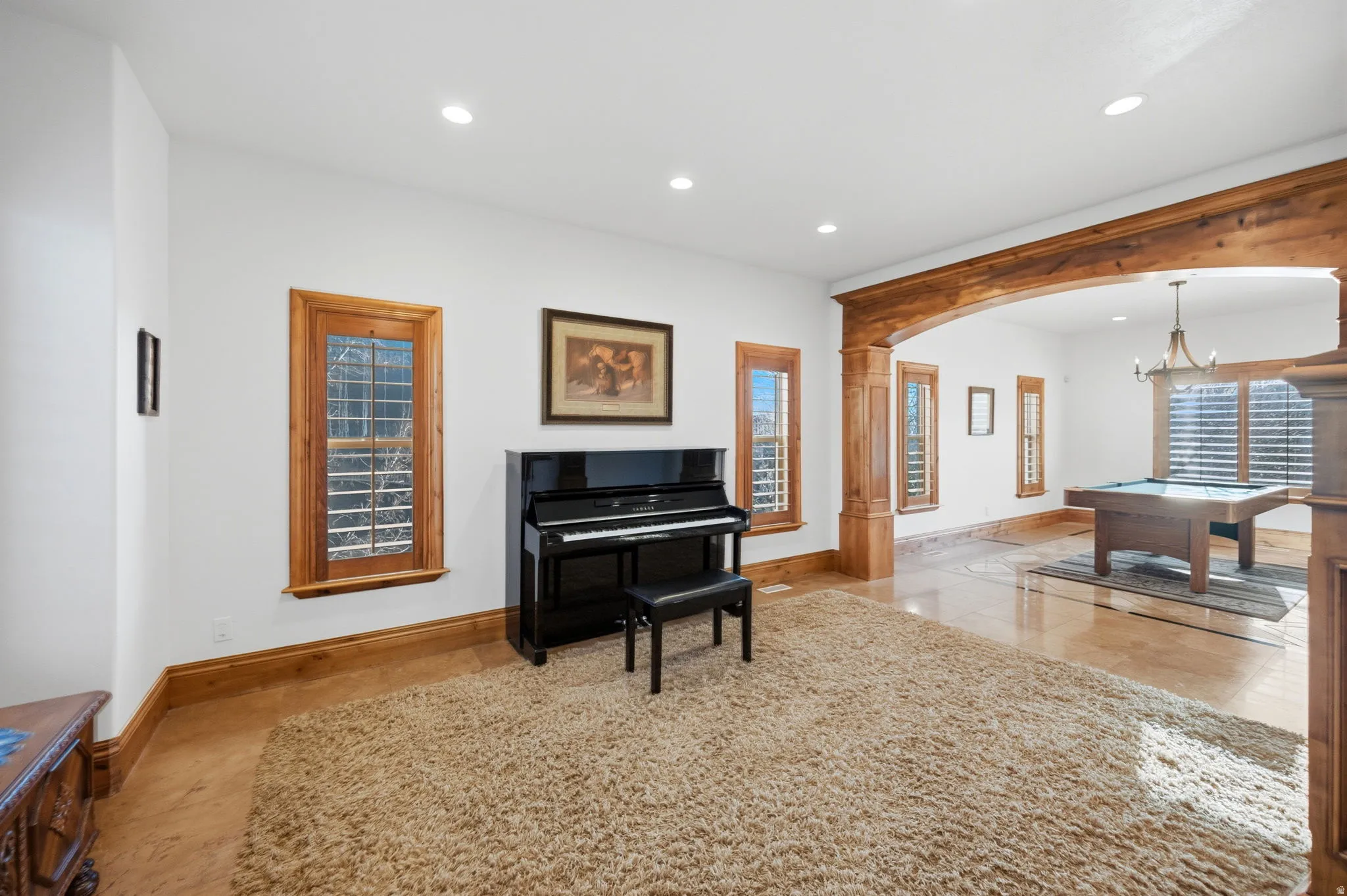 Sitting room featuring arched walkways, recessed lighting, and billiards