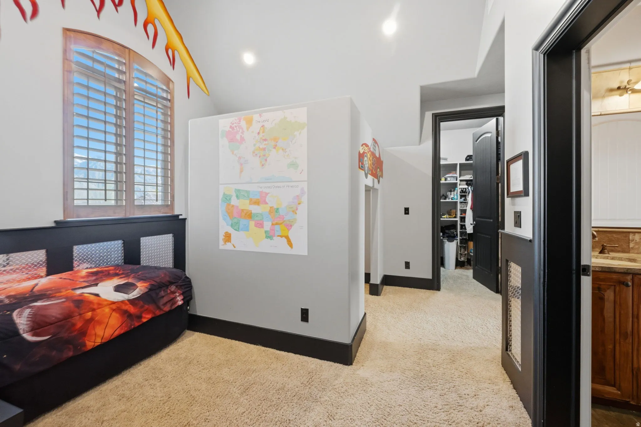 Bedroom with light colored carpet and recessed lighting