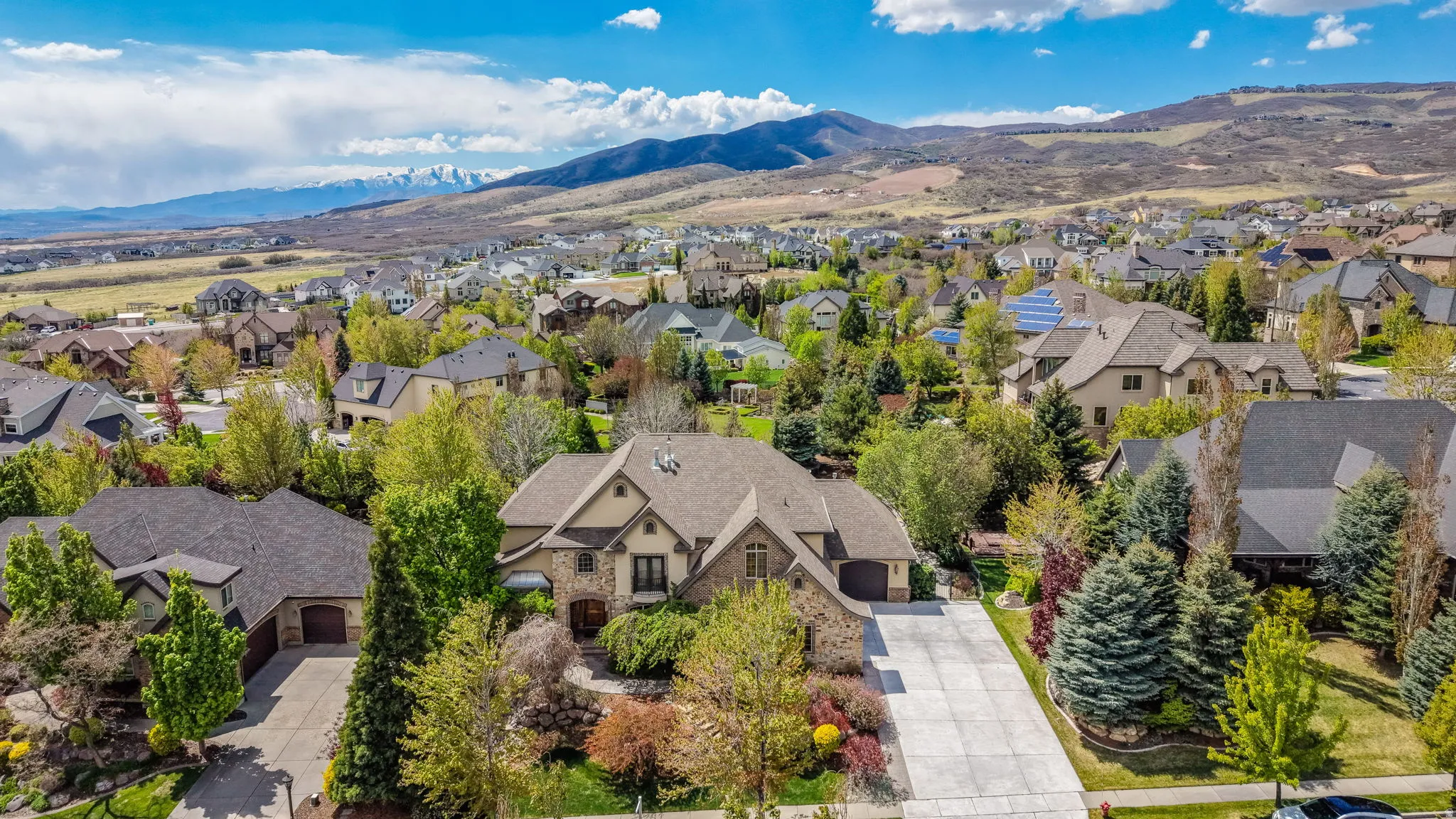 Aerial perspective of suburban area with a mountainous background