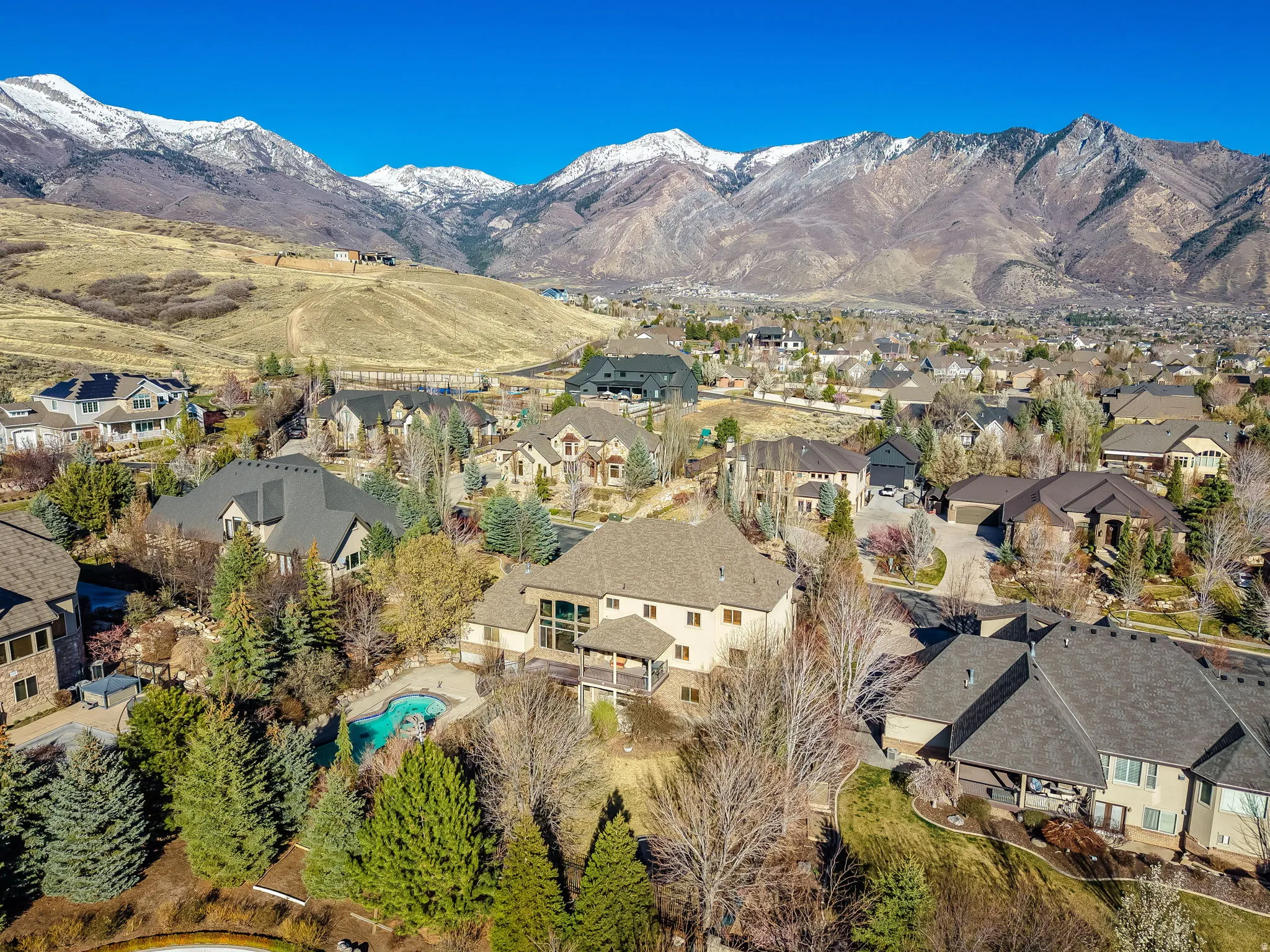 Aerial view of residential area with a mountainous background