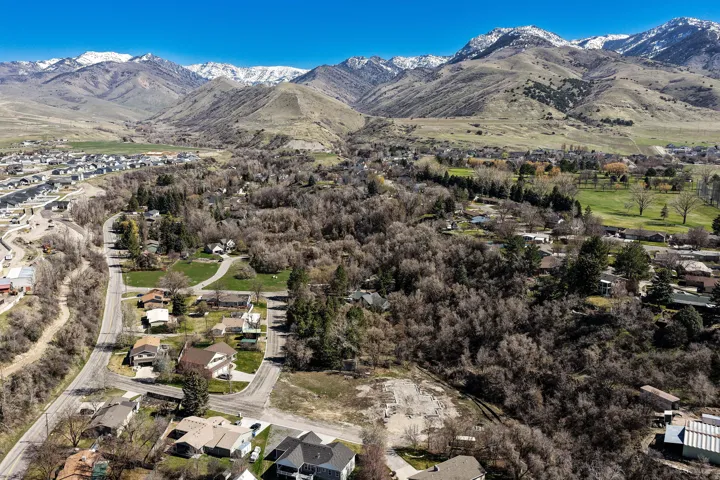 Aerial view of residential area featuring a mountainous background