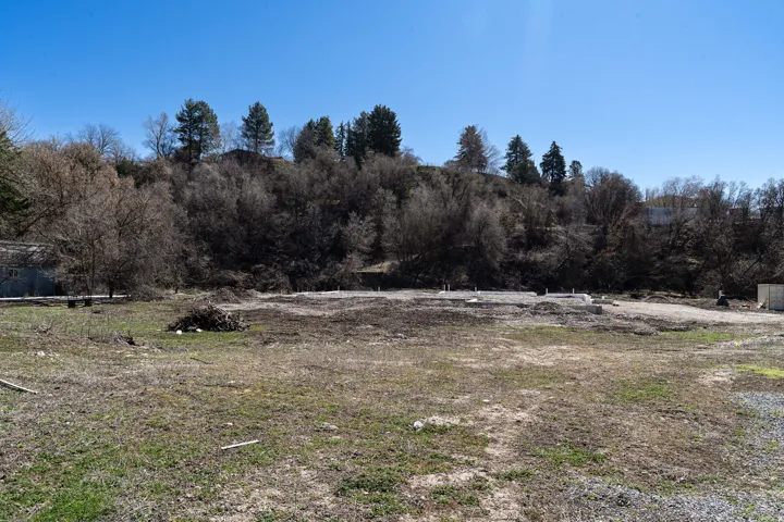Summit Creek is the rear border of the lot