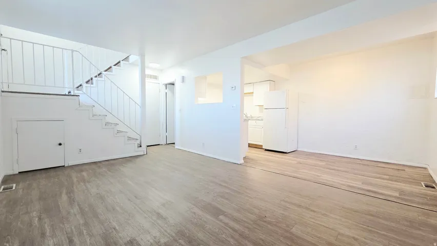 Unfurnished living room with light wood-style floors