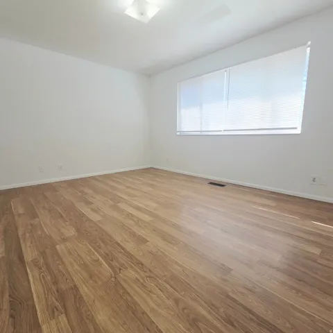 Empty room featuring light wood-style floors and baseboards