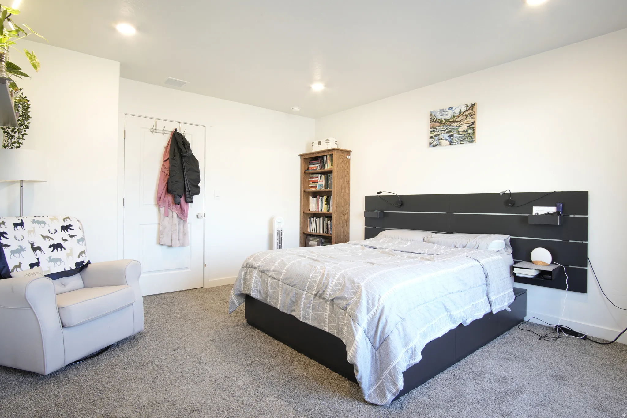Carpeted bedroom with baseboards and recessed lighting