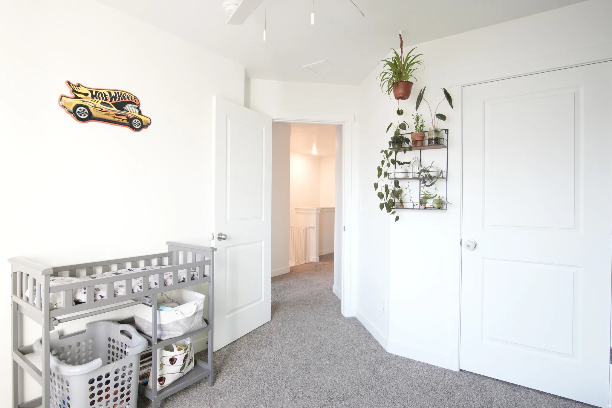 Bedroom with light carpet and baseboards