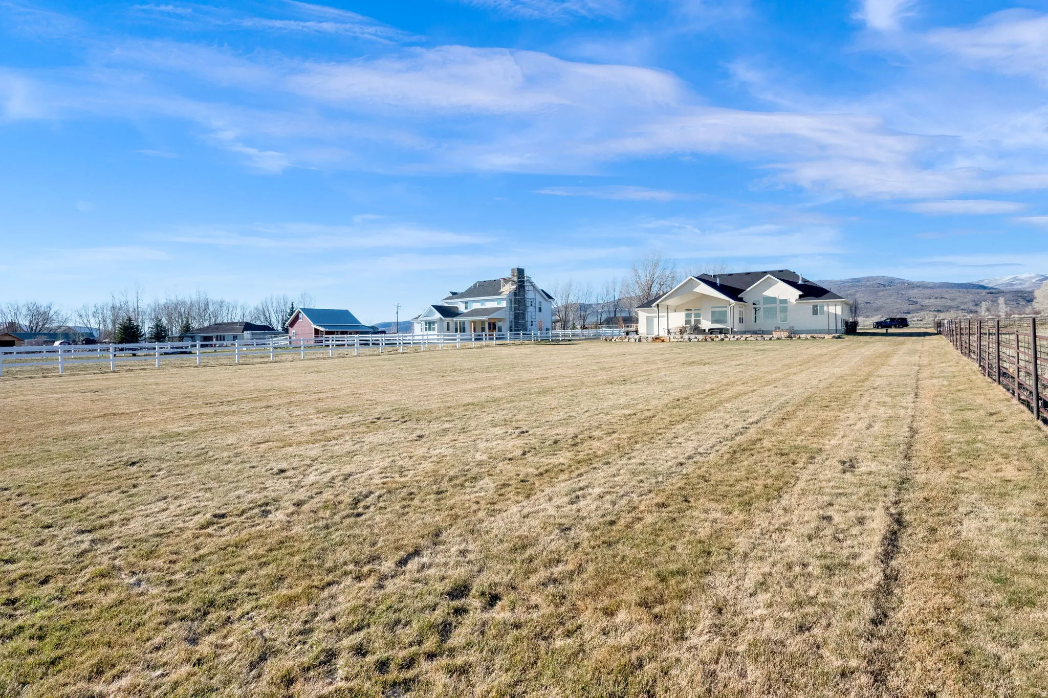 View of yard featuring a view of rural / pastoral area and a mountain view