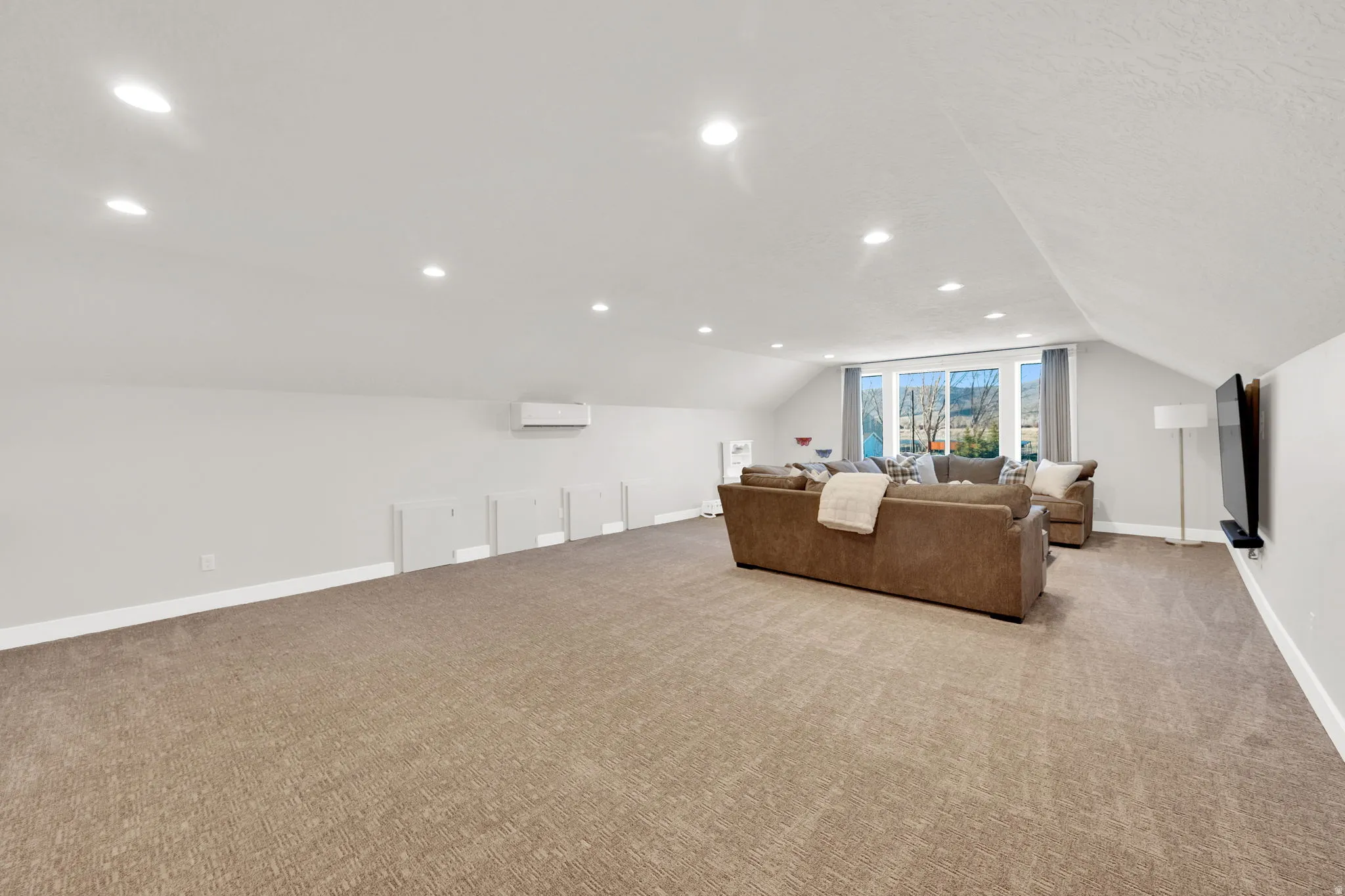 Living room featuring light carpet and recessed lighting