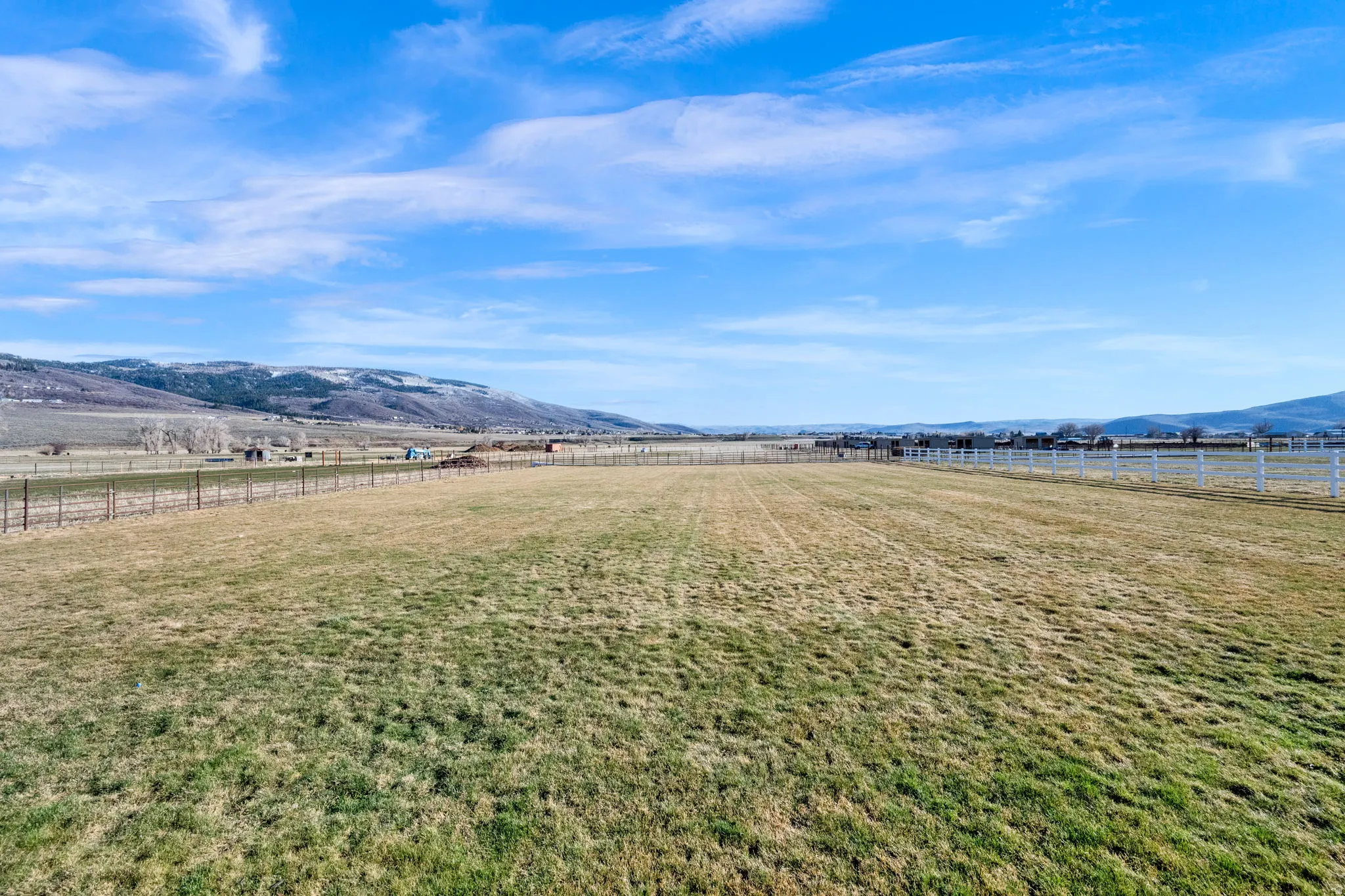 View of yard with a rural view and a mountain view