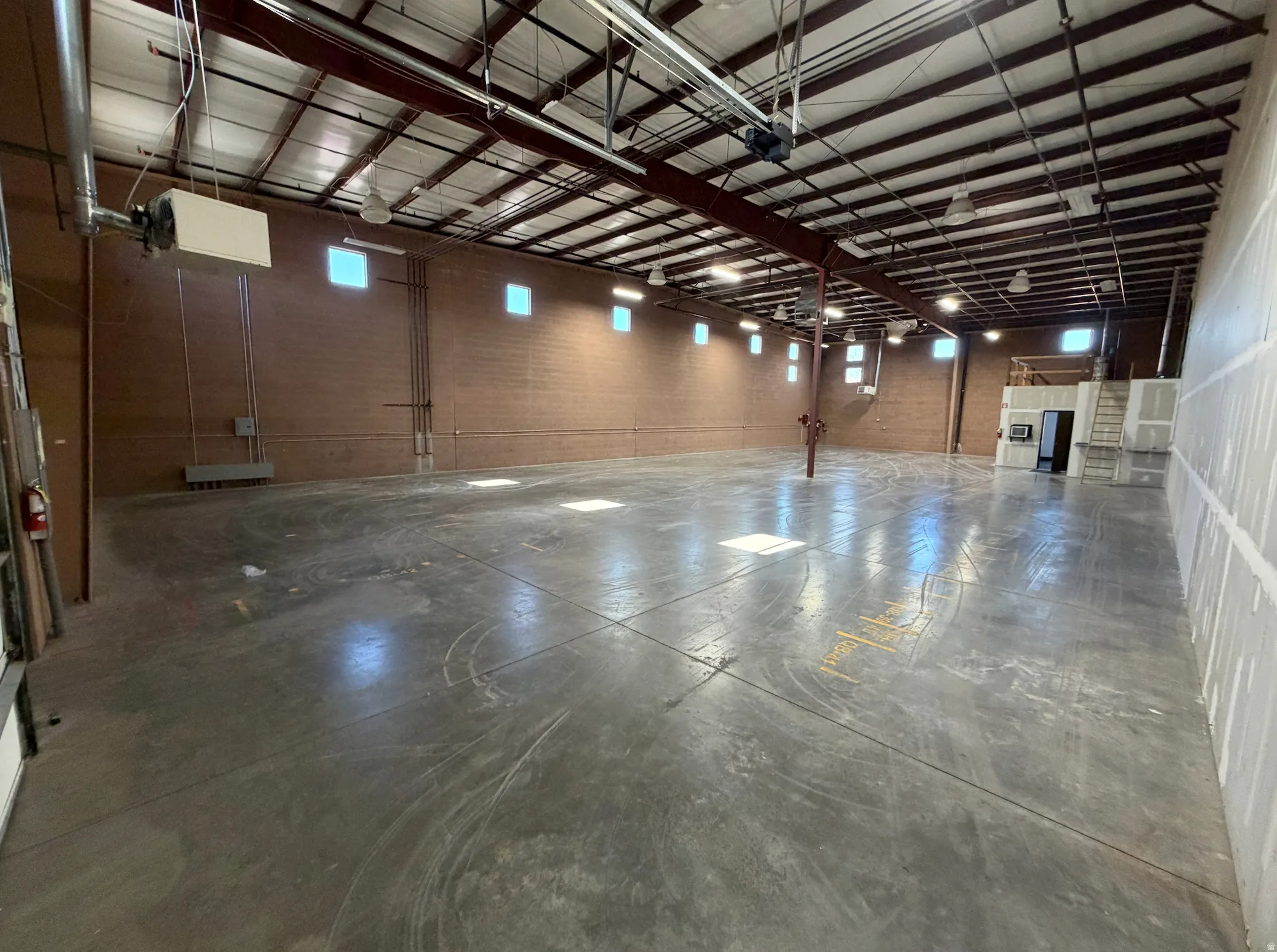 Garage featuring a heating unit