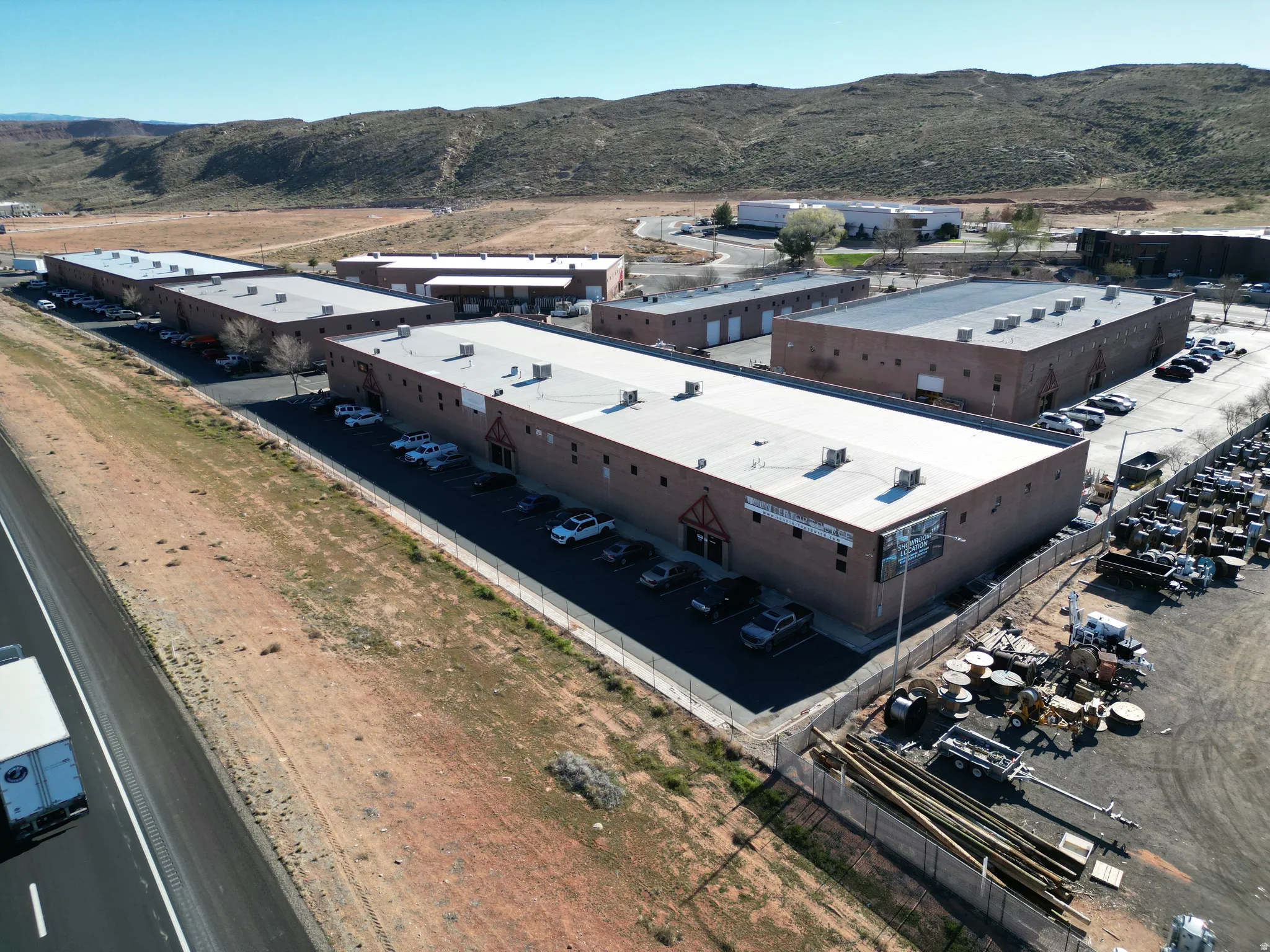 View of property location featuring an industrial area and a mountainous background