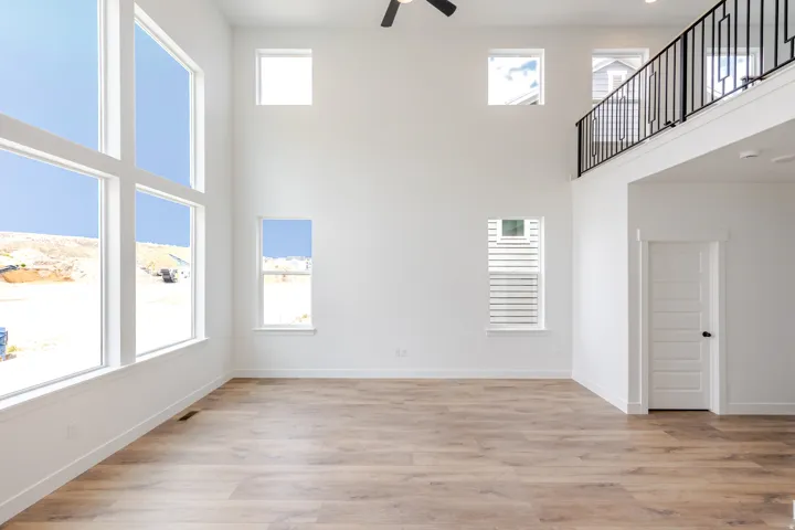 Grand living area featuring soaring ceilings and expansive windows
