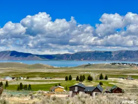 View of mountain backdrop with a nearby body of water