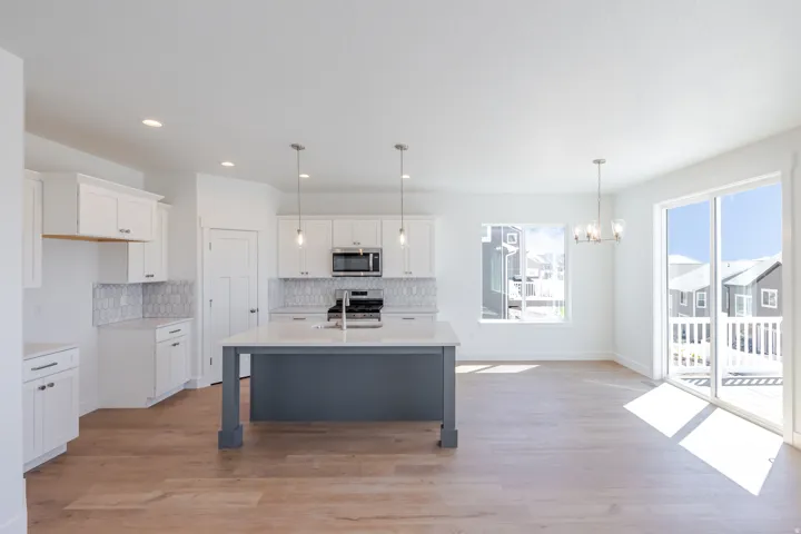 White shaker cabinetry with dark hardware