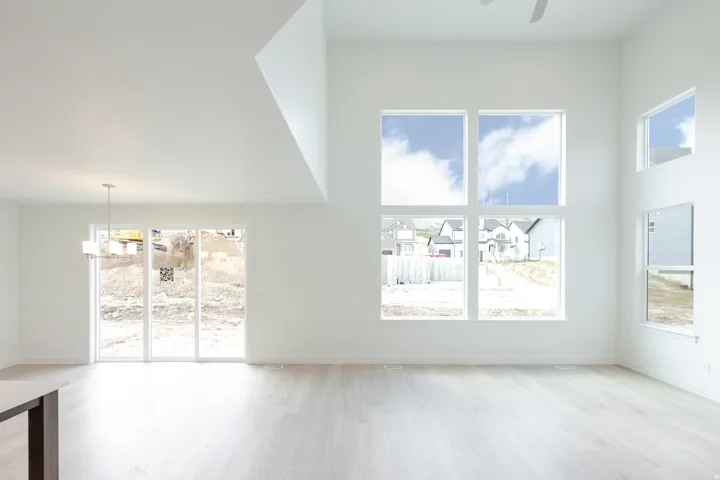 Spacious interior with high ceilings and light wood-finish flooring