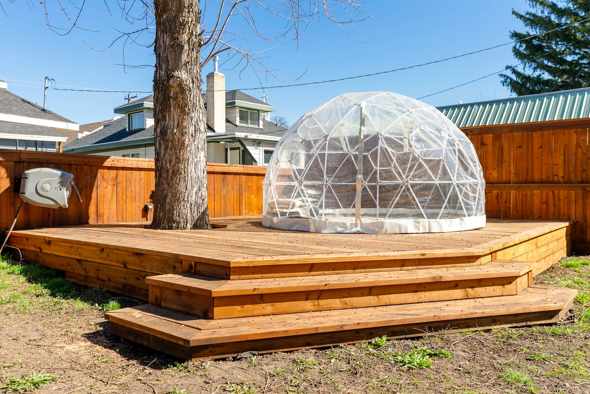 Deck with a fenced backyard