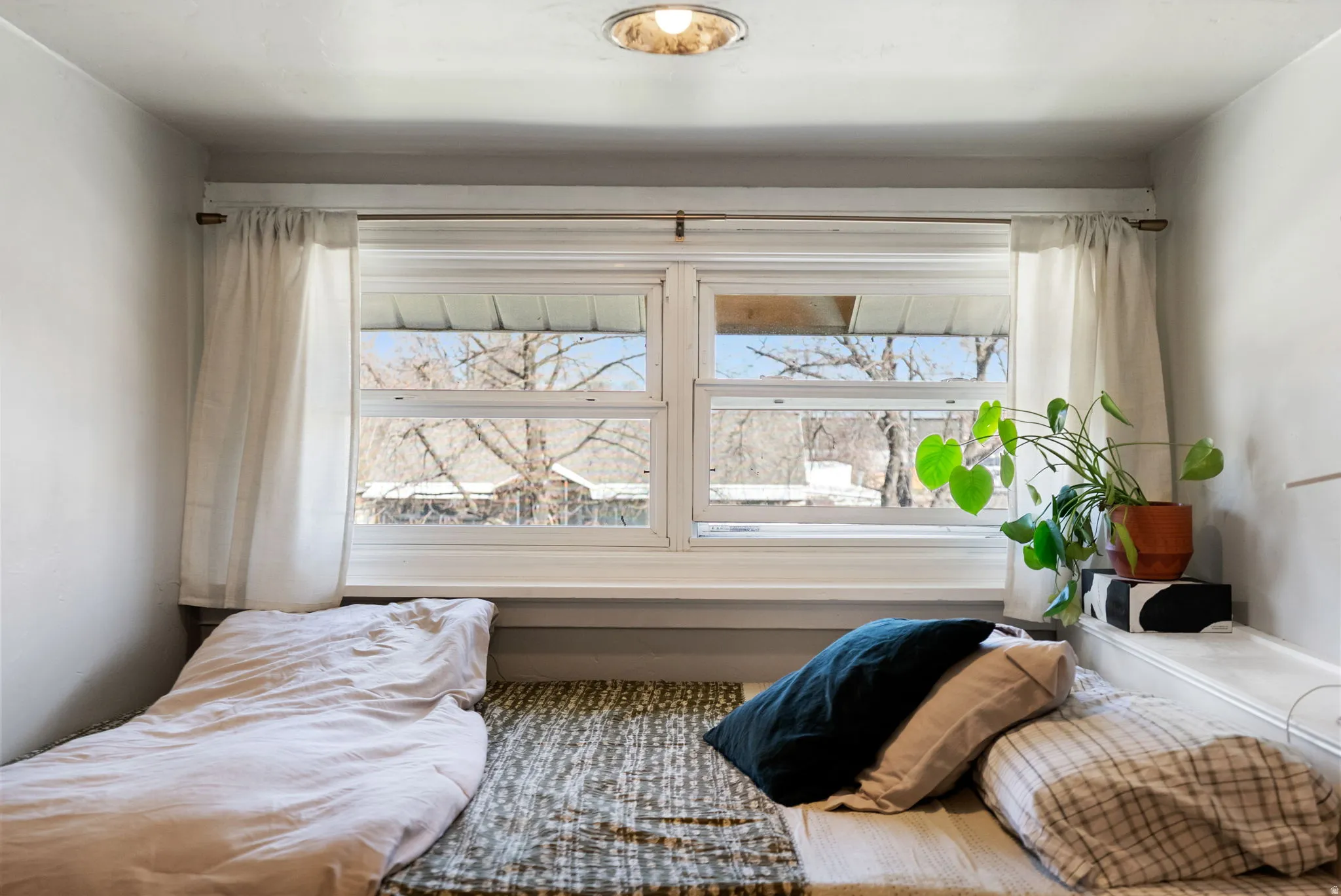 Bedroom featuring multiple windows