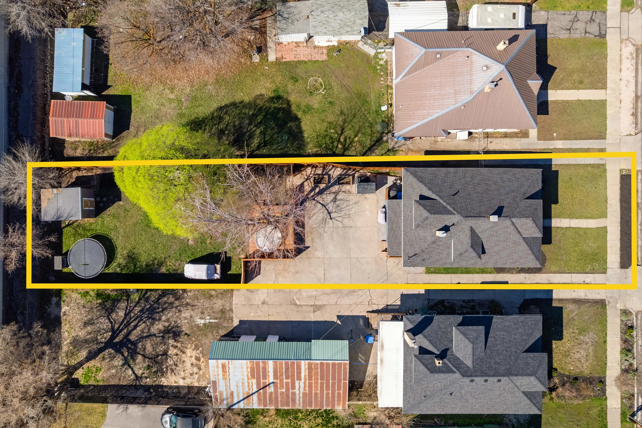 Aerial perspective of suburban area with property boundaries highlighted