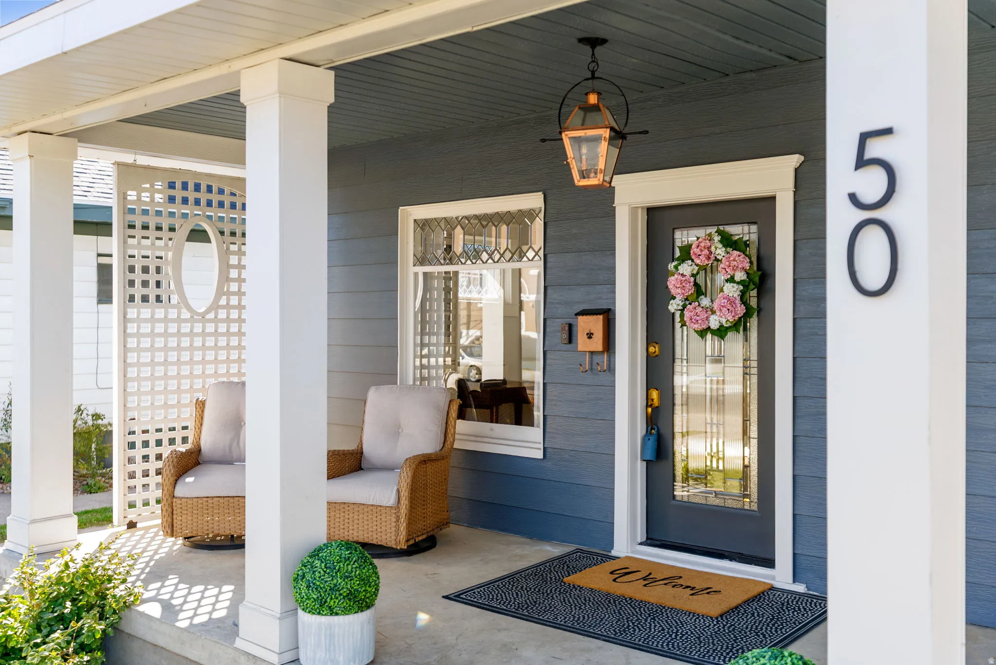 Doorway to property with covered porch