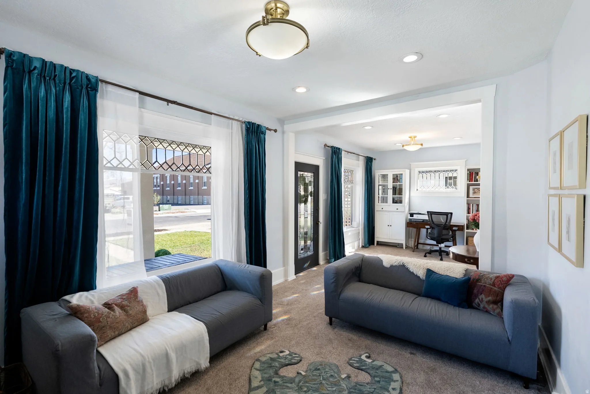 Living room featuring a desk, carpet, healthy amount of natural light, and recessed lighting