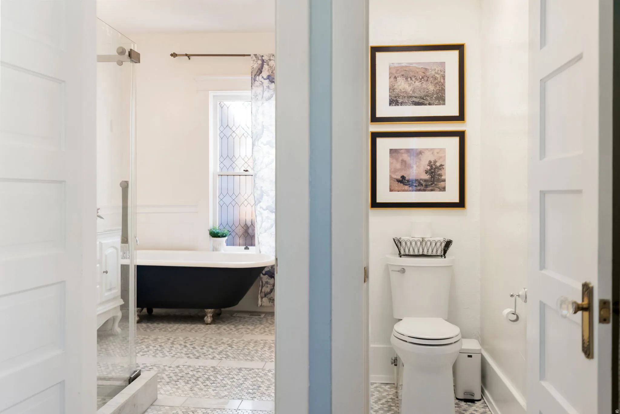 Bathroom featuring a soaking tub and light tile patterned flooring