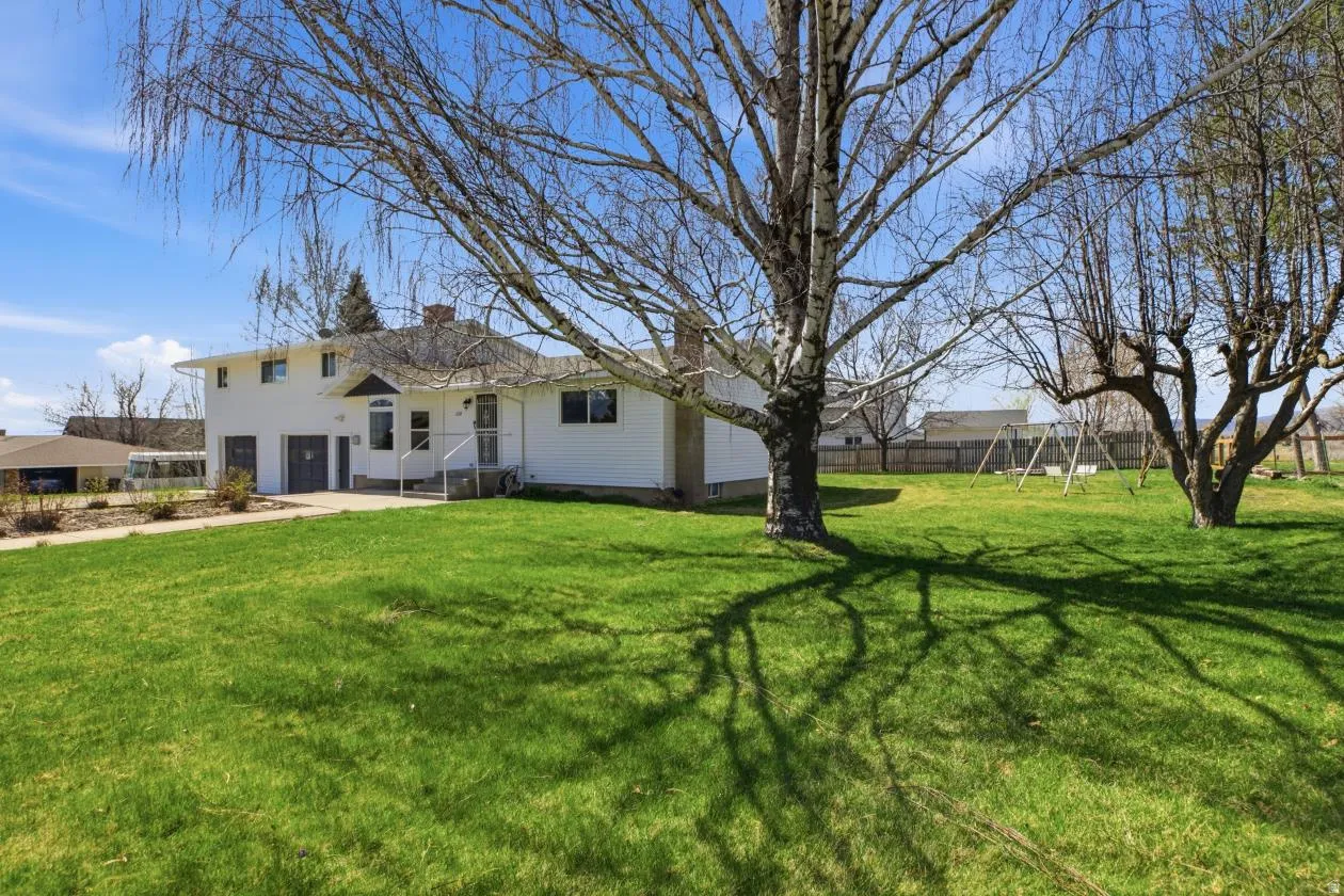 Back of house with a chimney