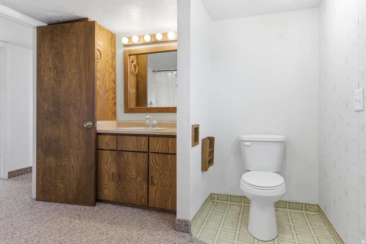 Bathroom featuring vanity and curtained shower