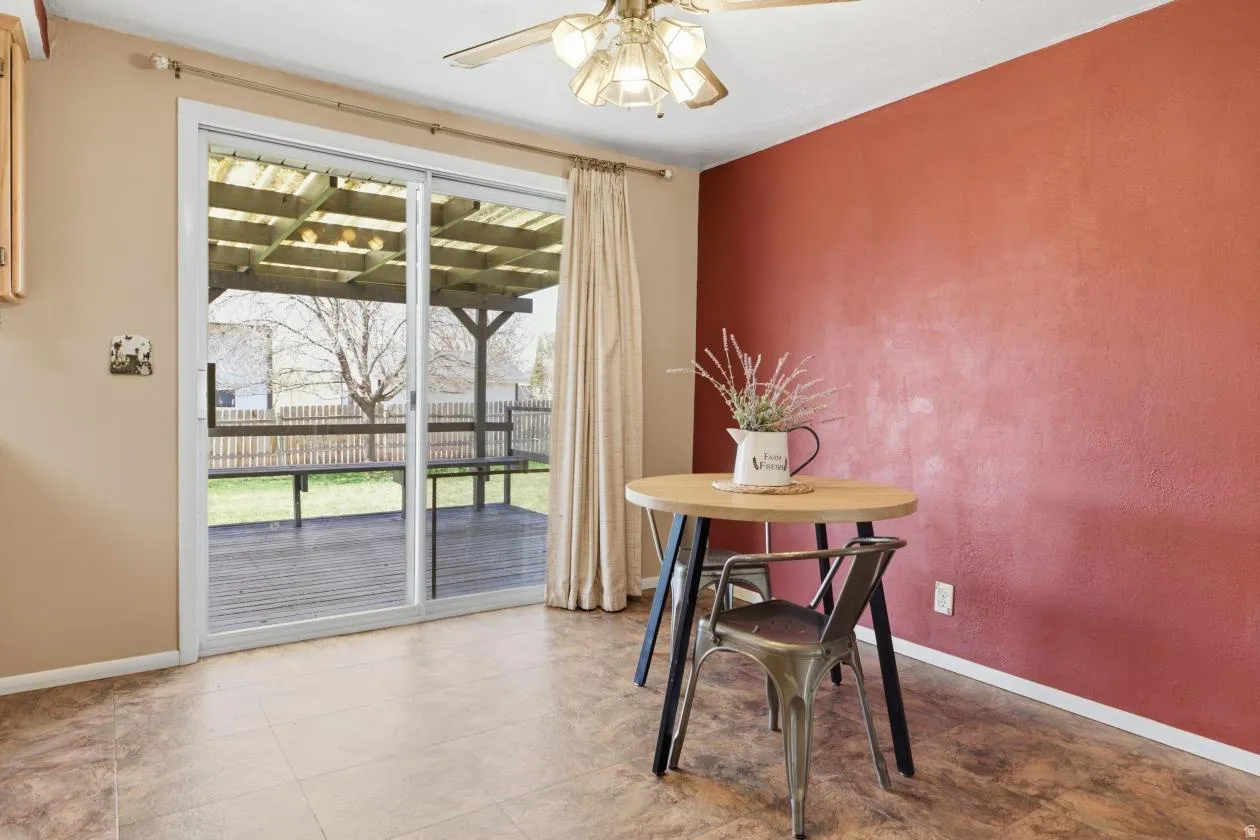 Dining room with baseboards and a ceiling fan