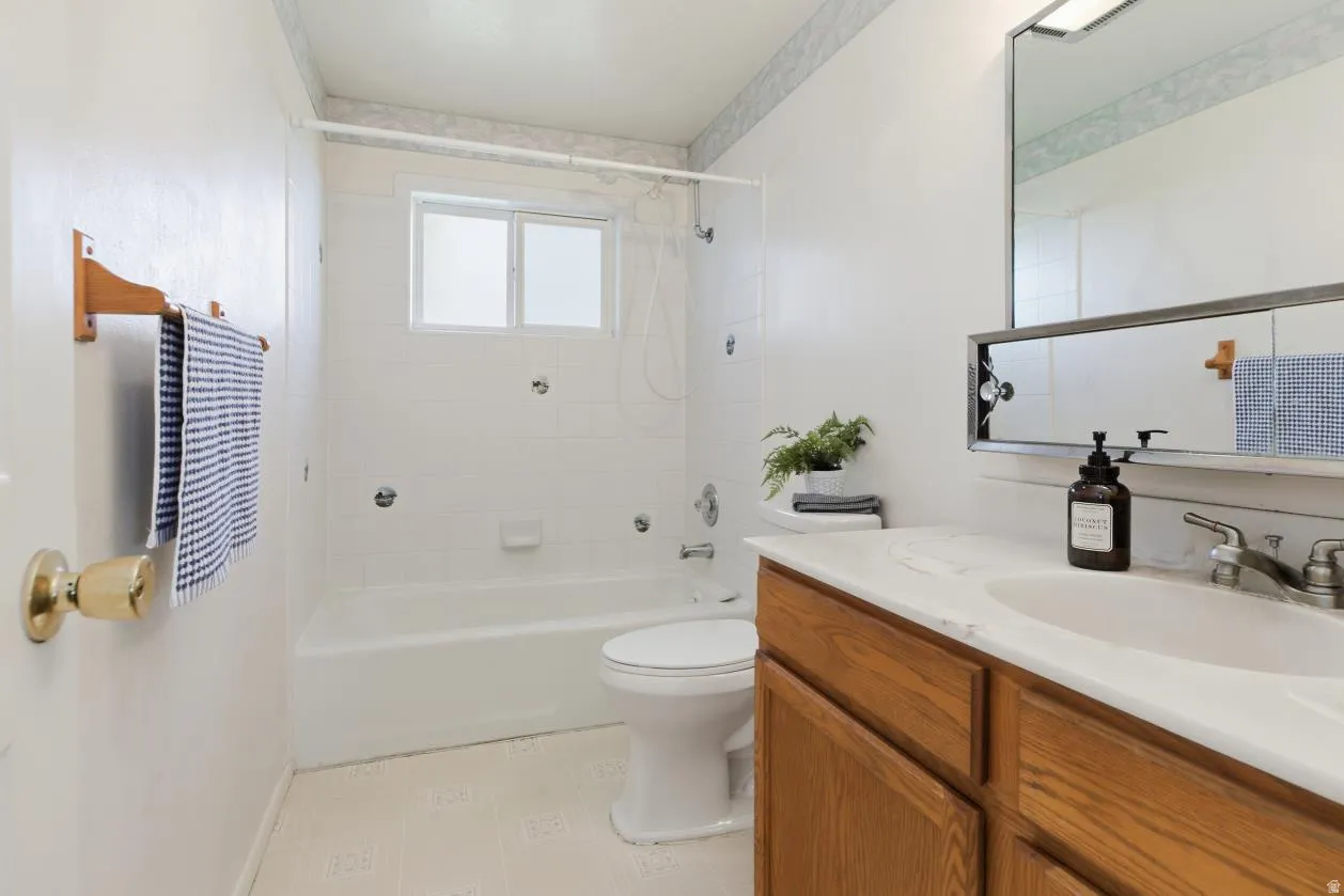 Bathroom with vanity and  shower combination
