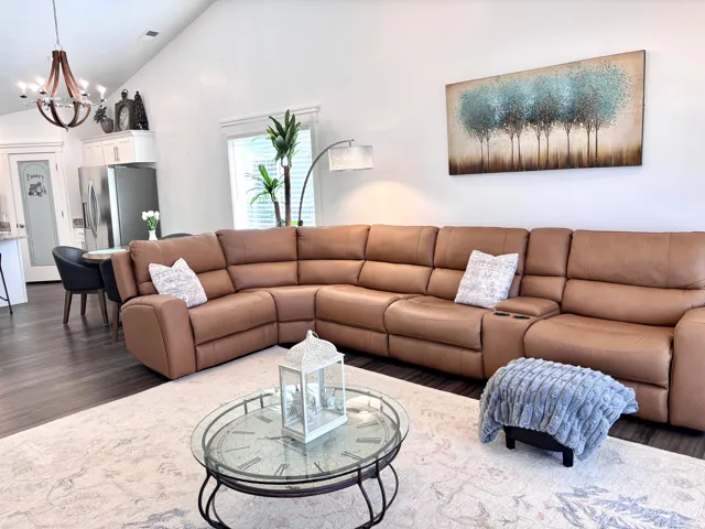 Airy living space with vaulted ceilings and plenty of room for large sectional seating.