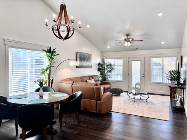Inviting family room with soaring ceilings, natural light, and an open layout perfect for gathering and entertaining.