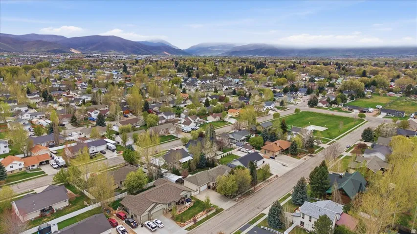 Aerial view of residential area featuring a mountainous background