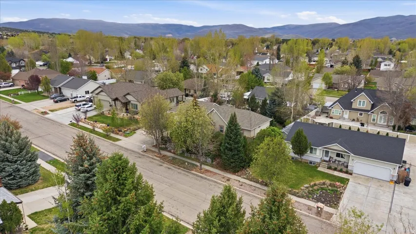 Aerial perspective of suburban area with a mountain backdrop