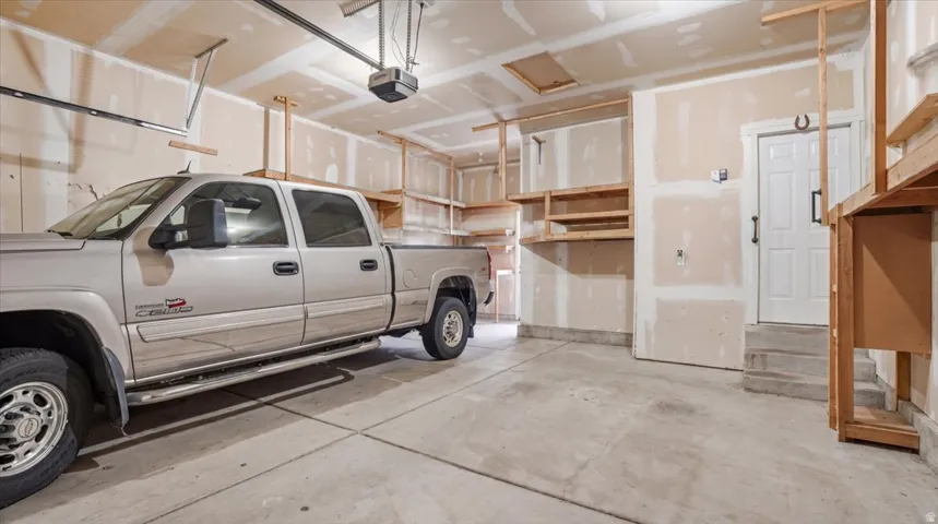Garage featuring a garage door opener