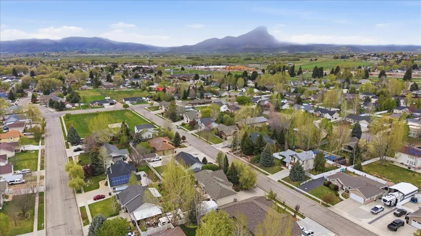 Aerial view of residential area featuring a mountainous background