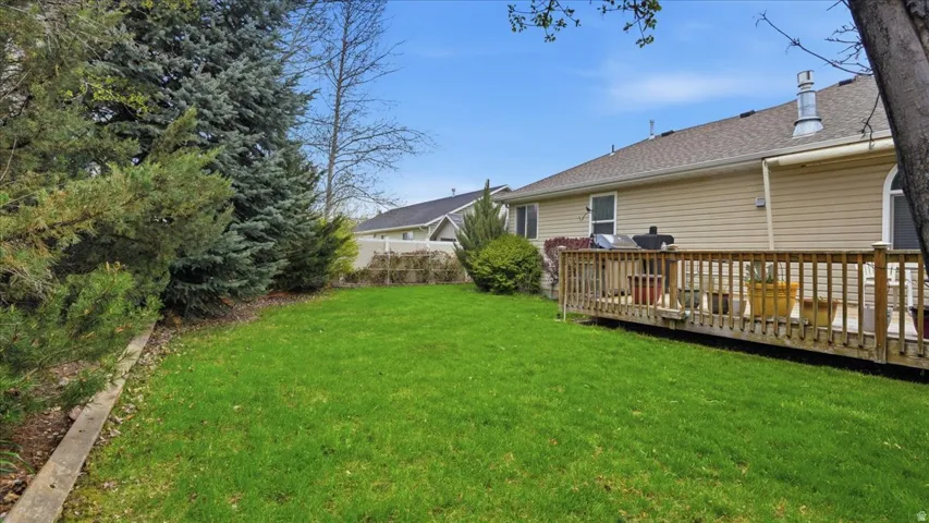 View of yard with a deck