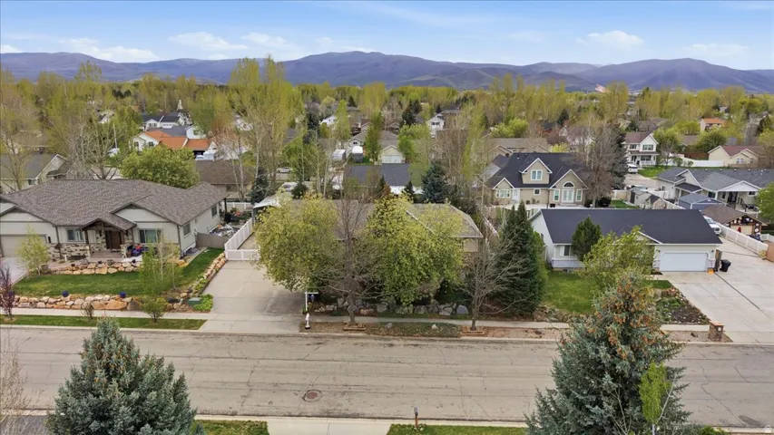 Aerial perspective of suburban area featuring a mountainous background