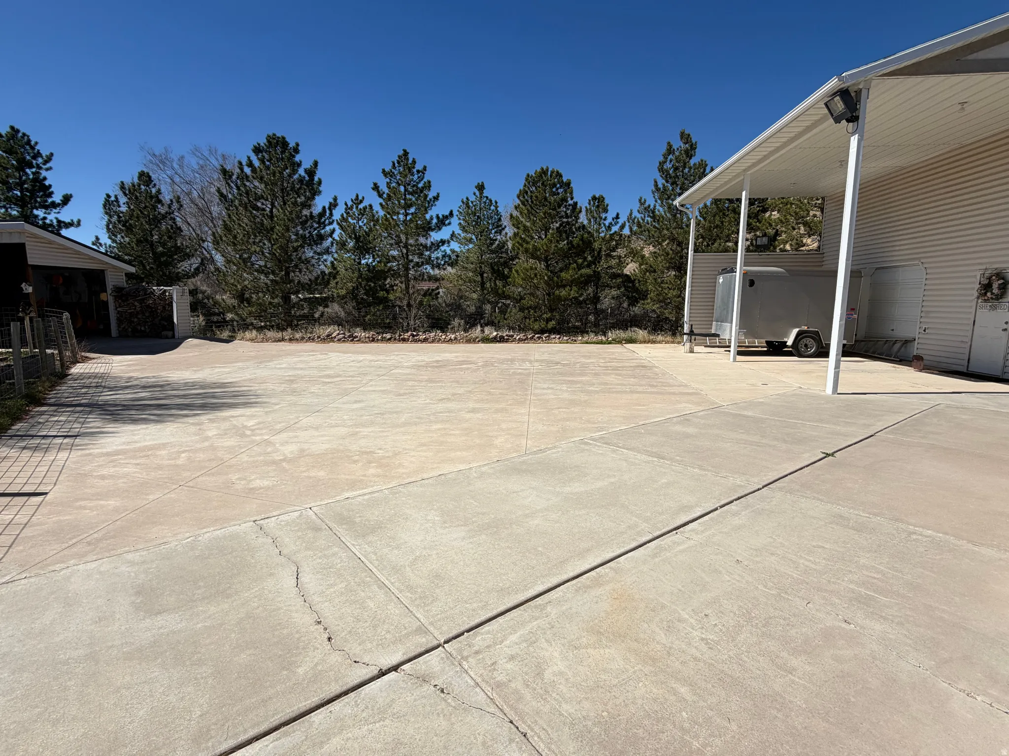 View of patio / terrace featuring concrete driveway