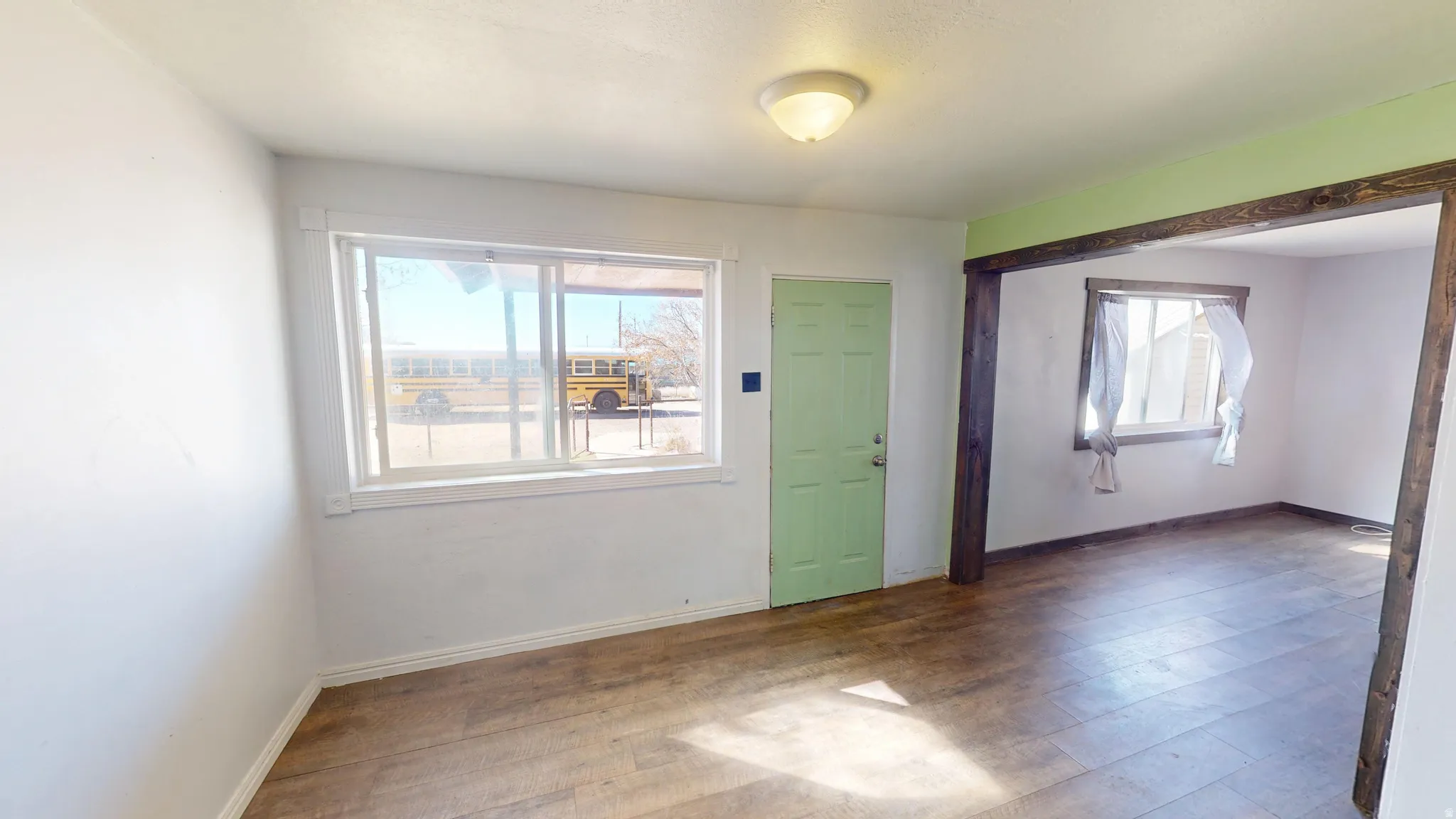 Foyer with hardwood / wood-style flooring and plenty of natural light