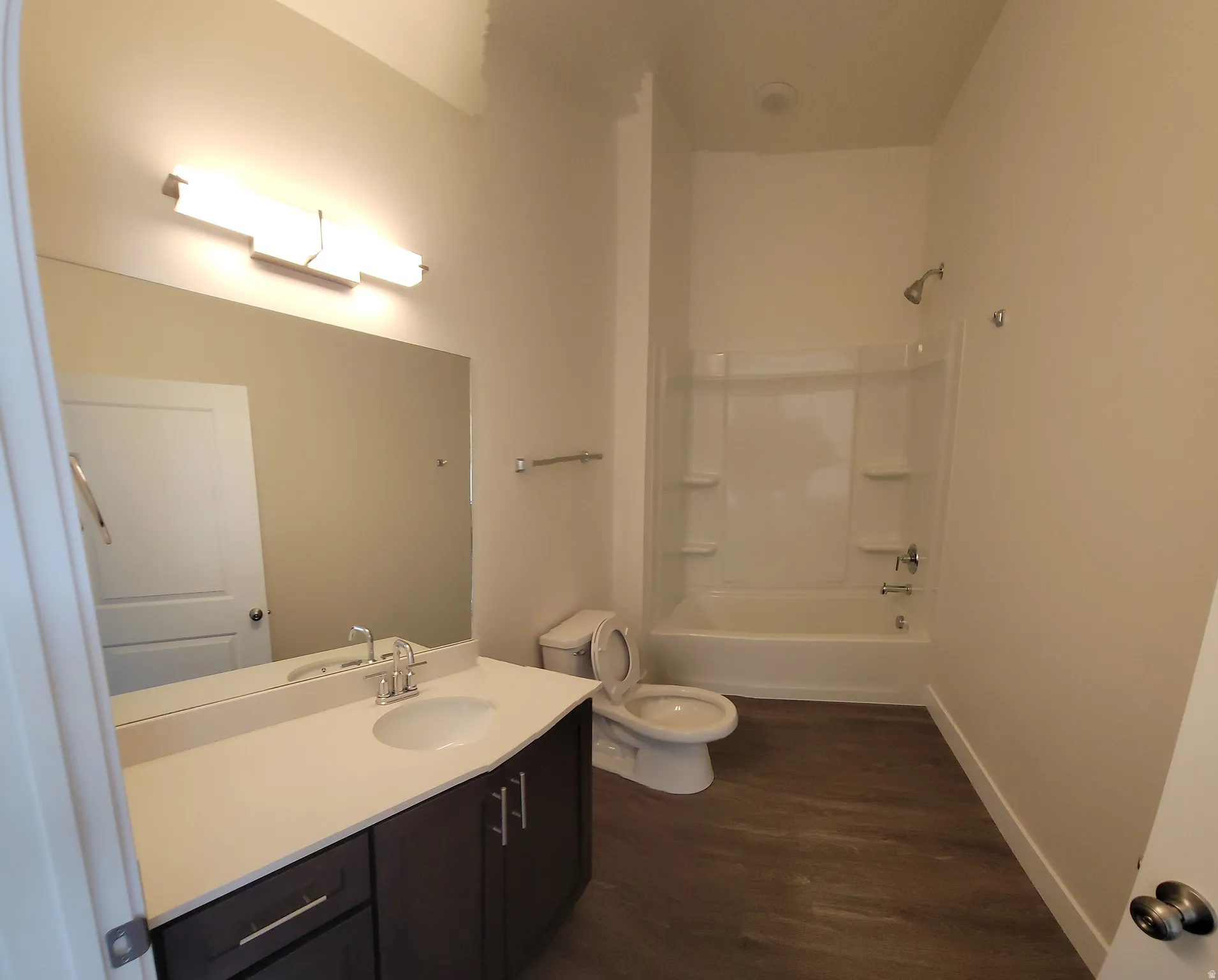 Full bath with vanity and a shower