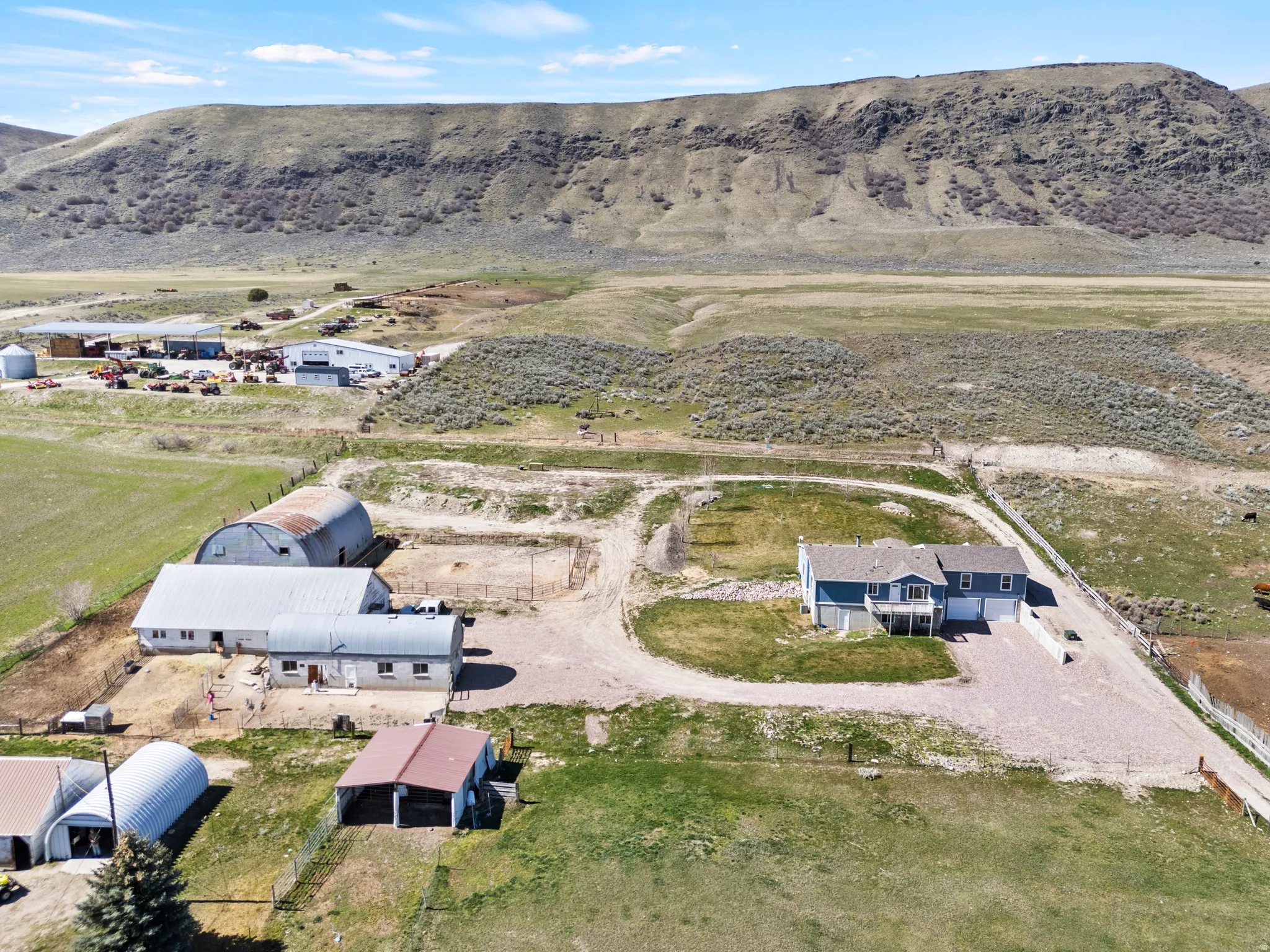 Aerial overview of property's location with rural landscape and a mountain backdrop