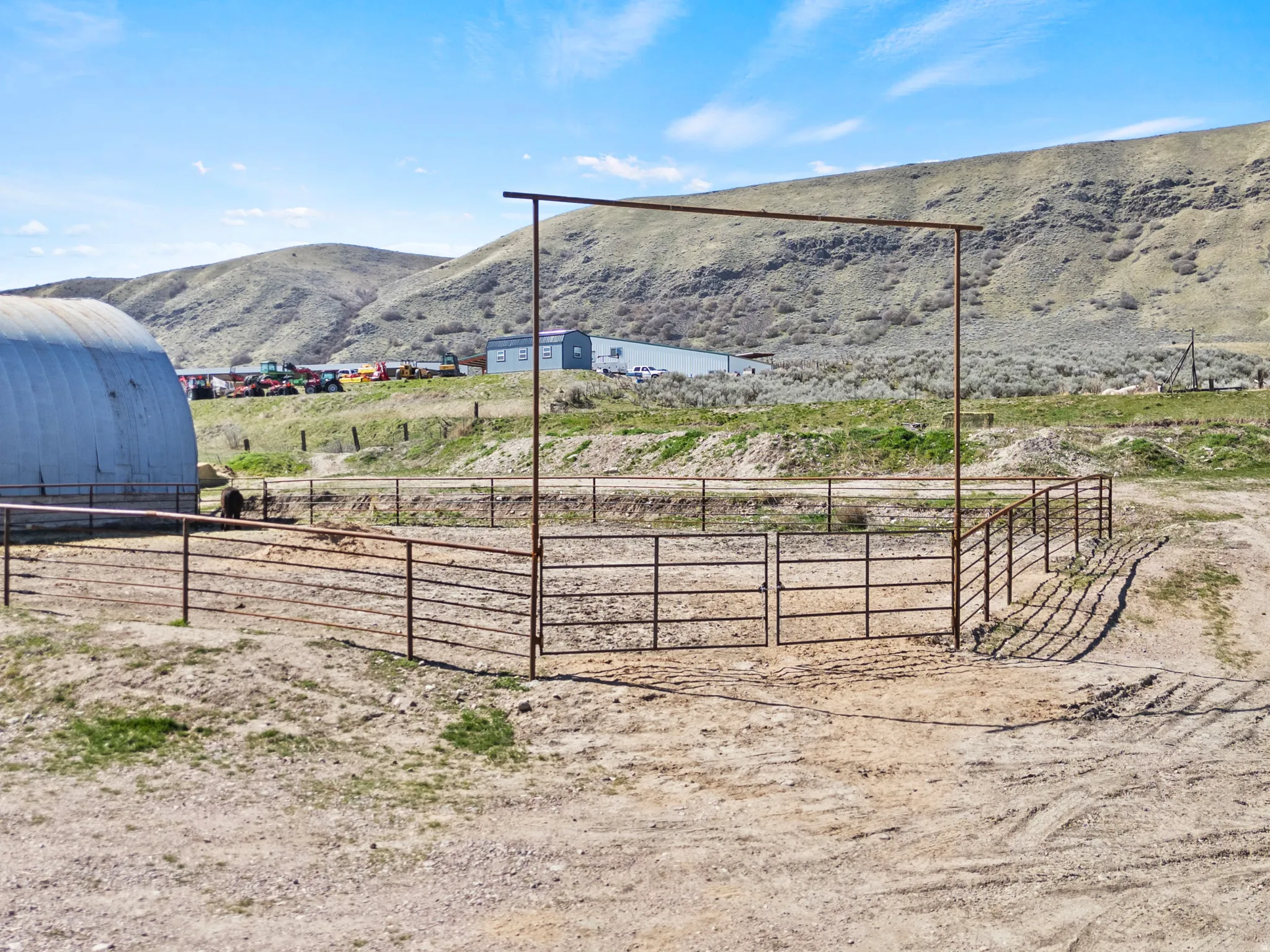 View of yard featuring an outdoor riding arena, a mountain view, and a rural view